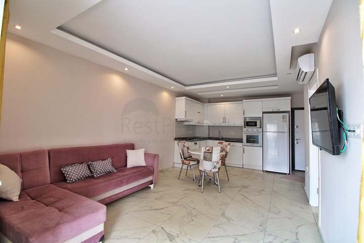 Двухкомнатная квартира в районе Махмутлар