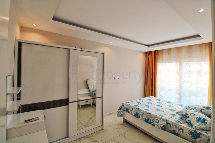 Двухкомнатная квартира в районе Махмутлар