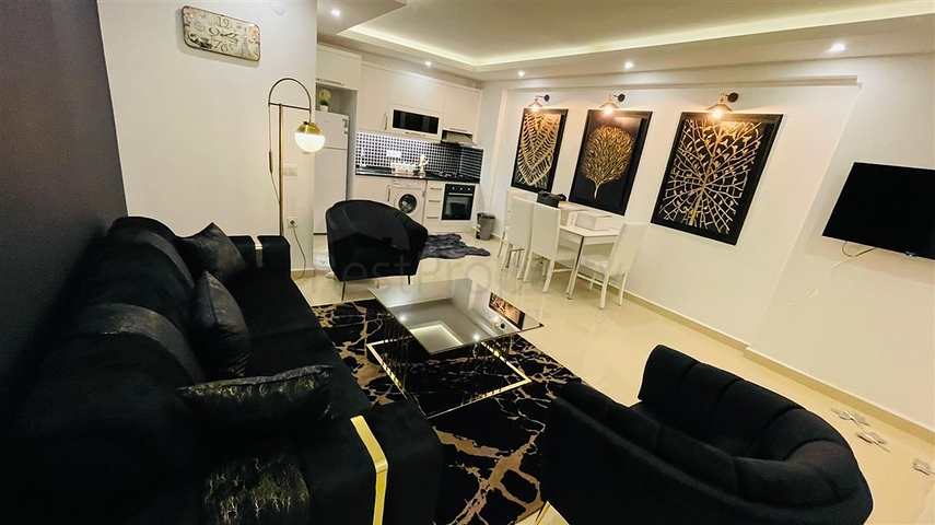 Меблированная квартира планировки 1+1 в жилом комплексе района Махмутлар