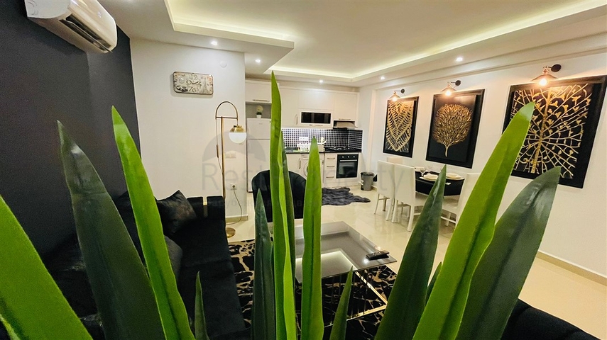 Меблированная квартира планировки 1+1 в жилом комплексе района Махмутлар