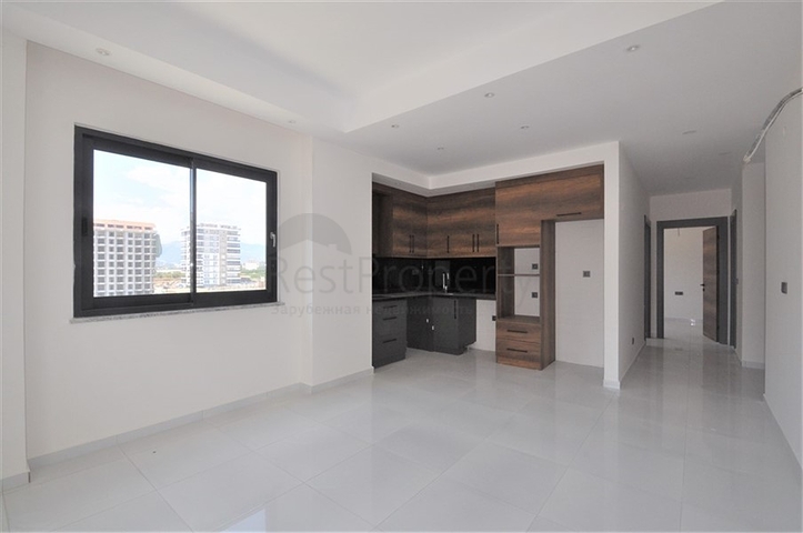 Трехкомнатная квартира в районе Махмутлар