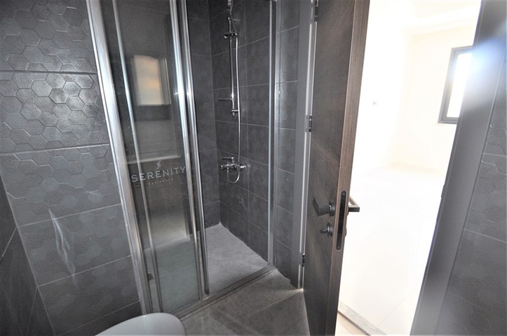 Трехкомнатная квартира в районе Махмутлар