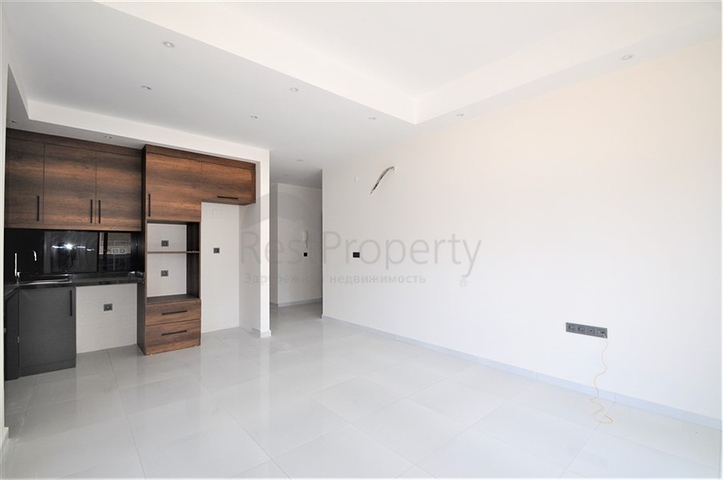 Трехкомнатная квартира в районе Махмутлар