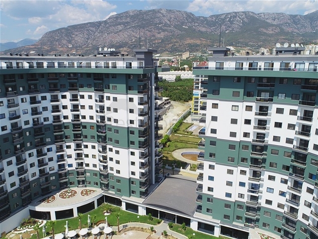 Трехкомнатная квартира в районе Махмутлар