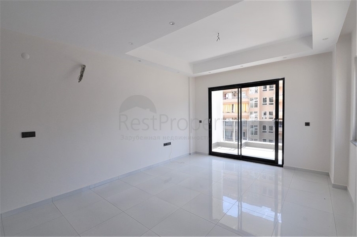 Трехкомнатная квартира в районе Махмутлар