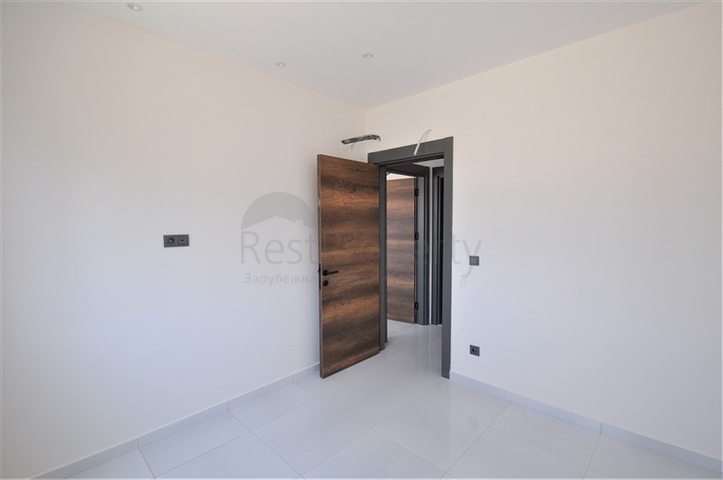 Трехкомнатная квартира в районе Махмутлар