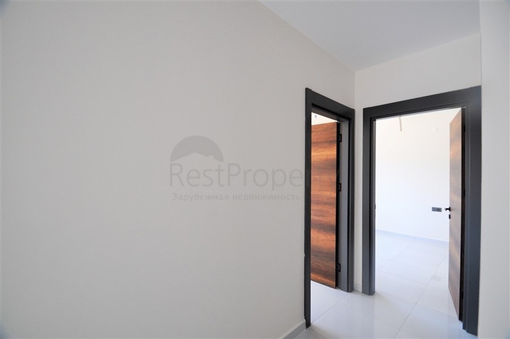 Трехкомнатная квартира в районе Махмутлар