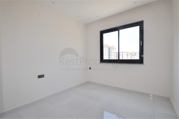 Трехкомнатная квартира в районе Махмутлар