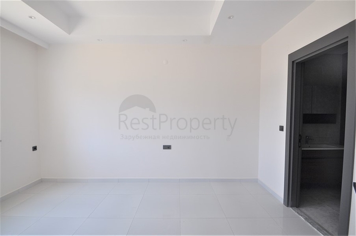 Трехкомнатная квартира в районе Махмутлар