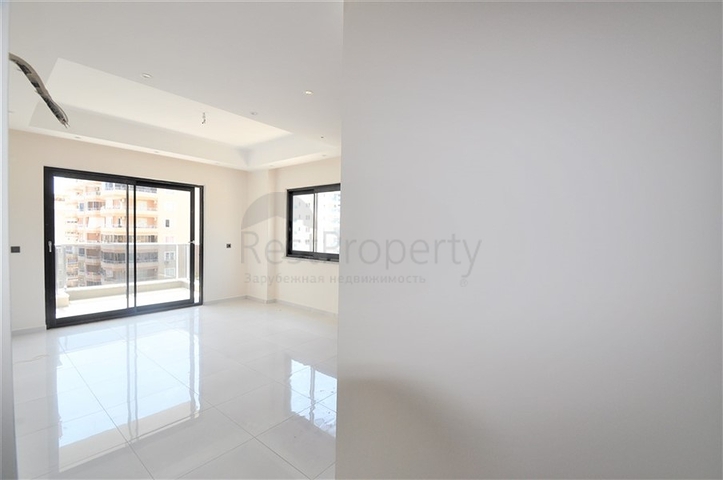 Трехкомнатная квартира в районе Махмутлар