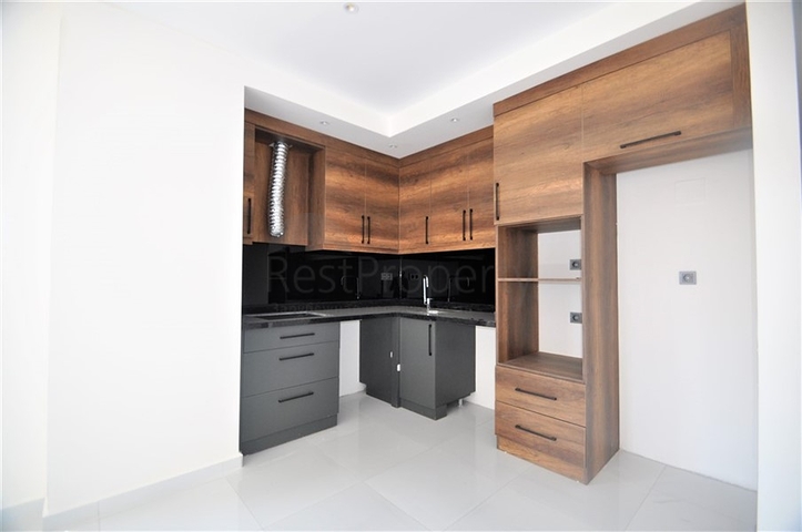 Трехкомнатная квартира в районе Махмутлар