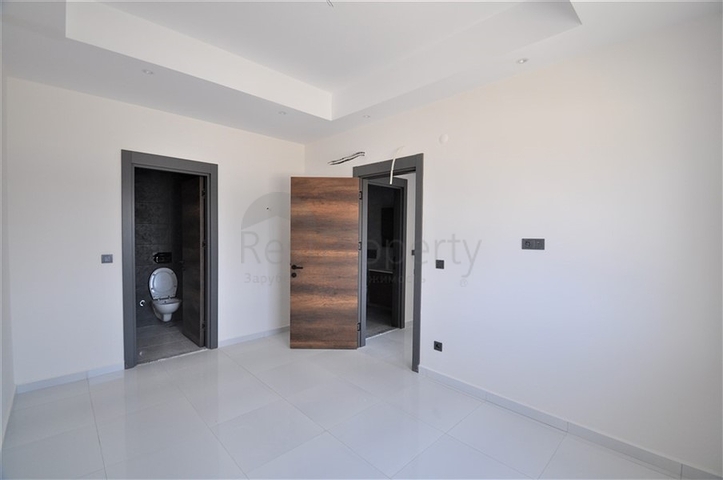 Трехкомнатная квартира в районе Махмутлар