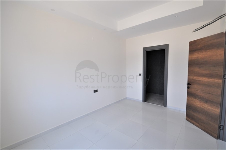 Трехкомнатная квартира в районе Махмутлар