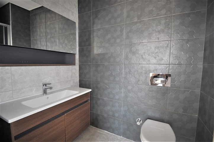 Трехкомнатная квартира в районе Махмутлар