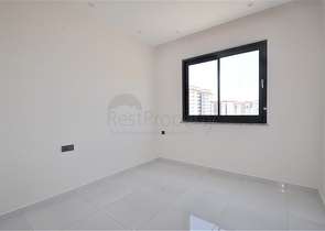 Трехкомнатная квартира в районе Махмутлар