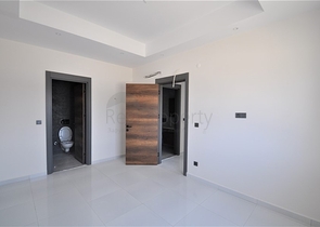 Трехкомнатная квартира в районе Махмутлар