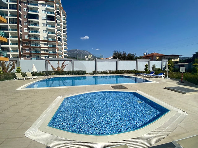 Стильная меблированная квартира в районе Махмутлар