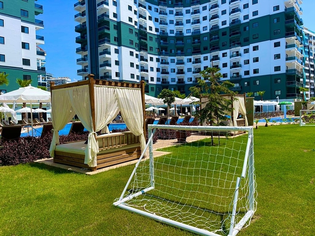 Квартира планировки 2+1 в ультрасовременном комплексе в центре Махмутлара