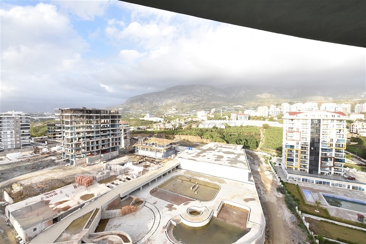 Квартира планировки 2+1 в ультрасовременном комплексе в центре Махмутлара