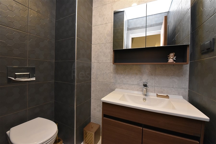 Квартира планировки 2+1 в ультрасовременном комплексе в центре Махмутлара