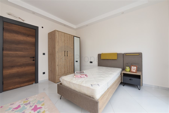 Квартира планировки 2+1 в ультрасовременном комплексе в центре Махмутлара