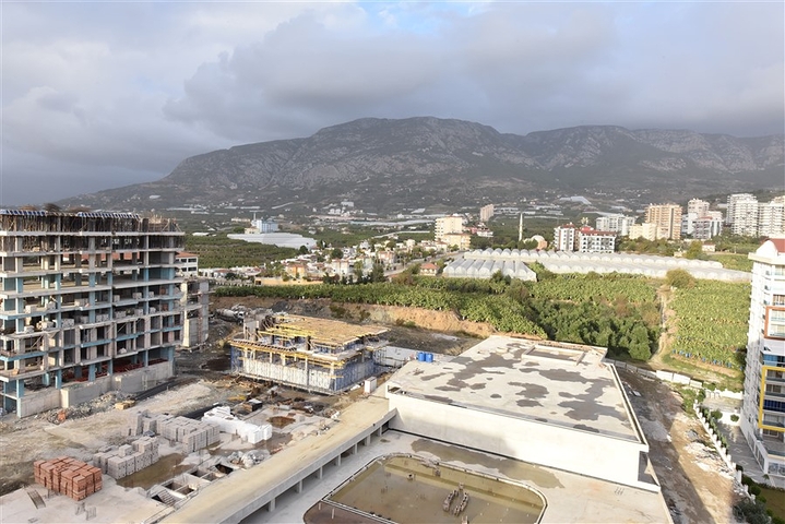 Квартира планировки 2+1 в ультрасовременном комплексе в центре Махмутлара