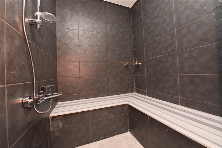 Квартира планировки 2+1 в ультрасовременном комплексе в центре Махмутлара