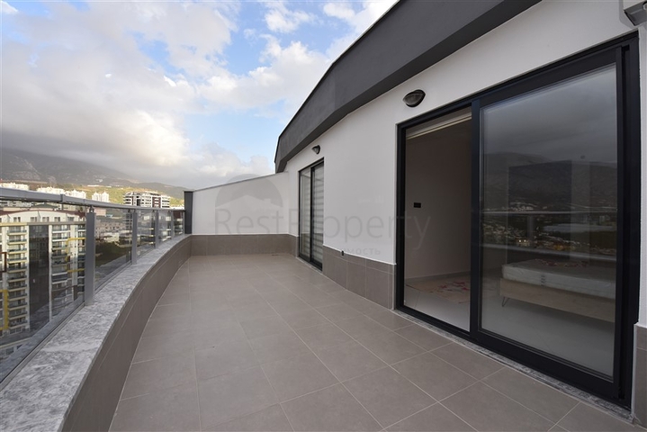 Квартира планировки 2+1 в ультрасовременном комплексе в центре Махмутлара