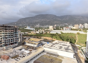 Квартира планировки 2+1 в ультрасовременном комплексе в центре Махмутлара