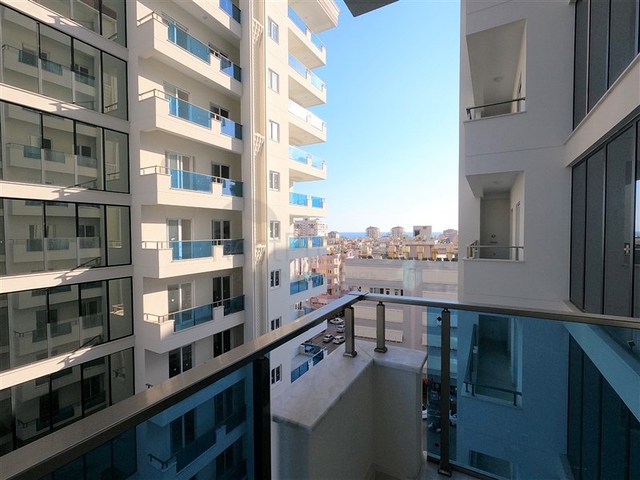 Просторная квартира 1+1 в элитном комплексе в районе Махмутлар