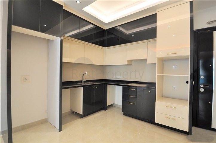 Просторная квартира 1+1 в элитном комплексе в районе Махмутлар