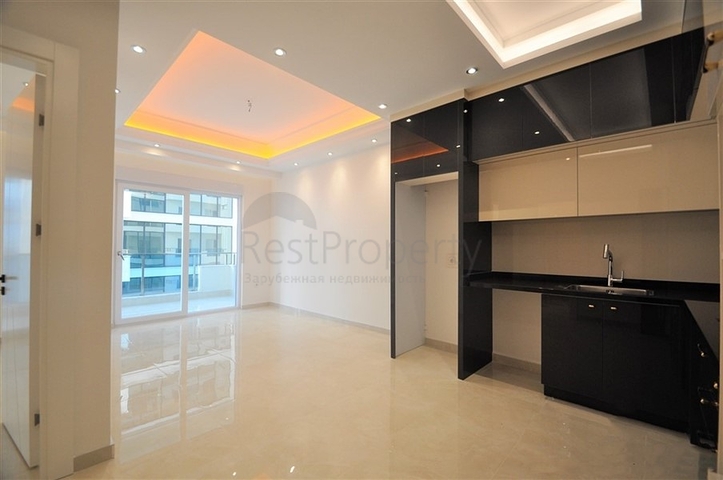 Просторная квартира 1+1 в элитном комплексе в районе Махмутлар