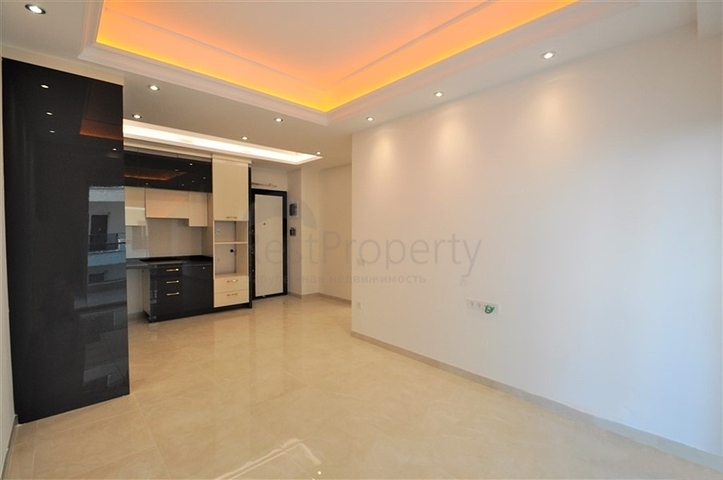 Просторная квартира 1+1 в элитном комплексе в районе Махмутлар
