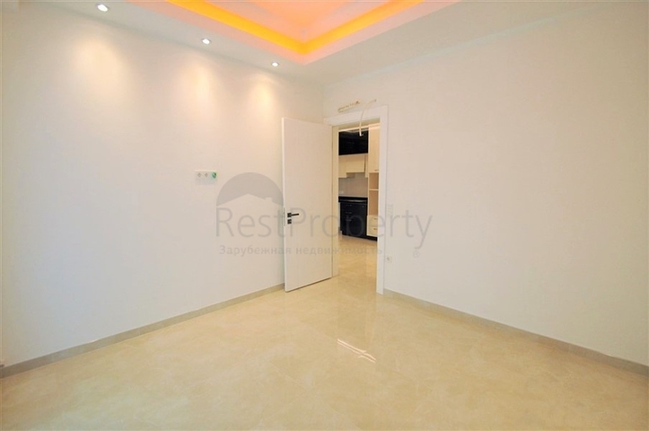 Просторная квартира 1+1 в элитном комплексе в районе Махмутлар