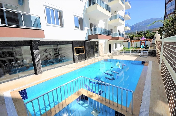 Двухкомнатная квартира в районе Махмутлар