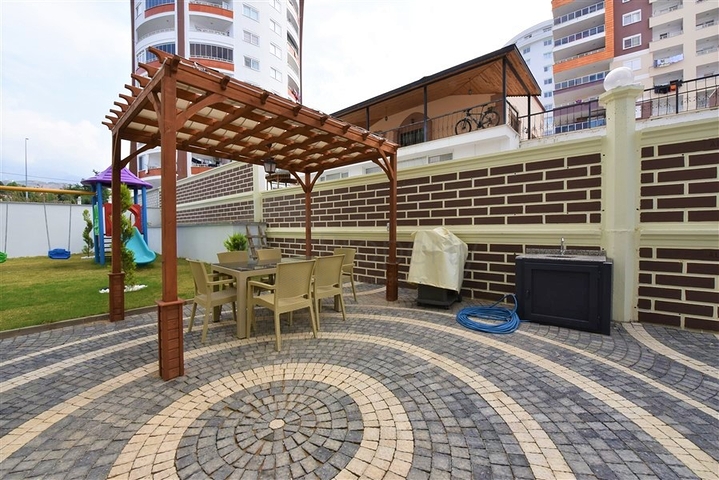 Двухкомнатная квартира в районе Махмутлар