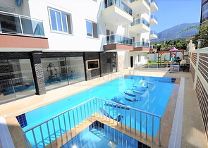 Двухкомнатная квартира в районе Махмутлар