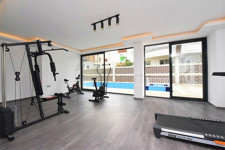 Меблированная квартира 1+1 в современном комплексе в районе Махмутлар