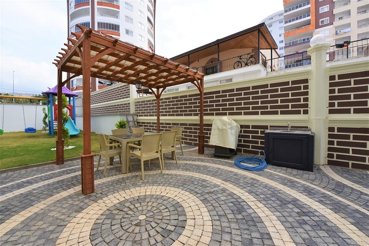 Меблированная квартира 1+1 в современном комплексе в районе Махмутлар