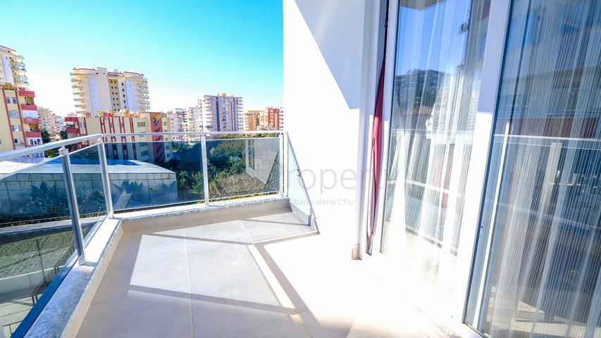 Меблированная квартира 1+1 в современном комплексе в районе Махмутлар