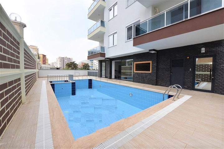 Меблированная квартира 1+1 в современном комплексе в районе Махмутлар