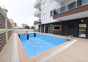 Меблированная квартира 1+1 в современном комплексе в районе Махмутлар