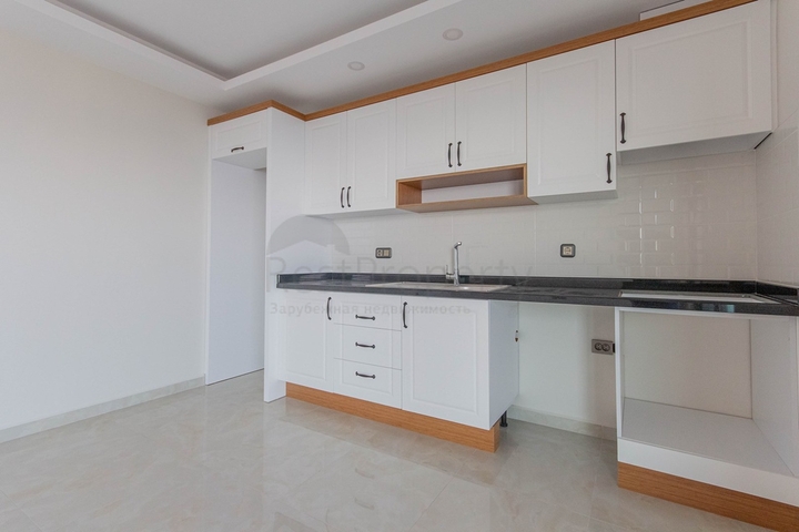 Апартаменты 2+1 на первой береговой в Махмутларе