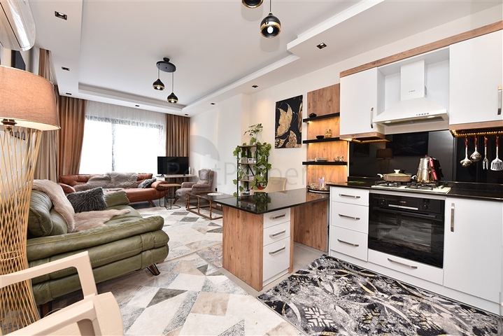 Меблированная двухкомнатная квартира в районе Махмутлар