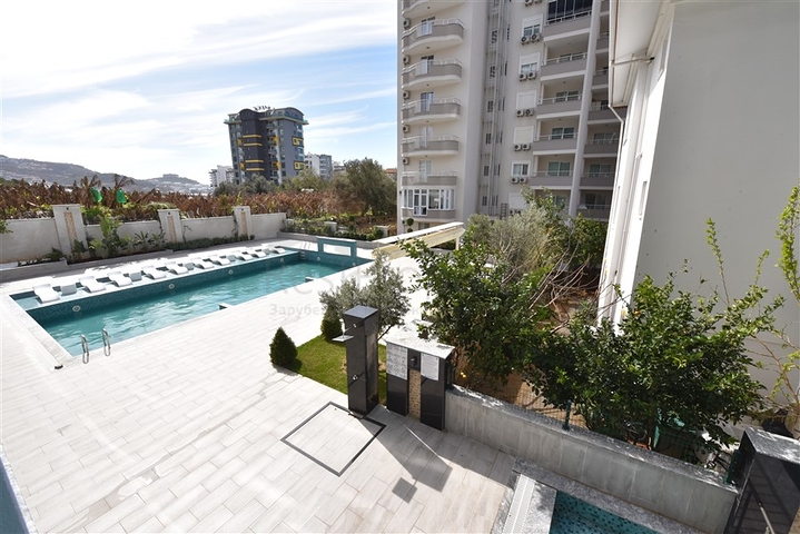 Меблированная двухкомнатная квартира в районе Махмутлар