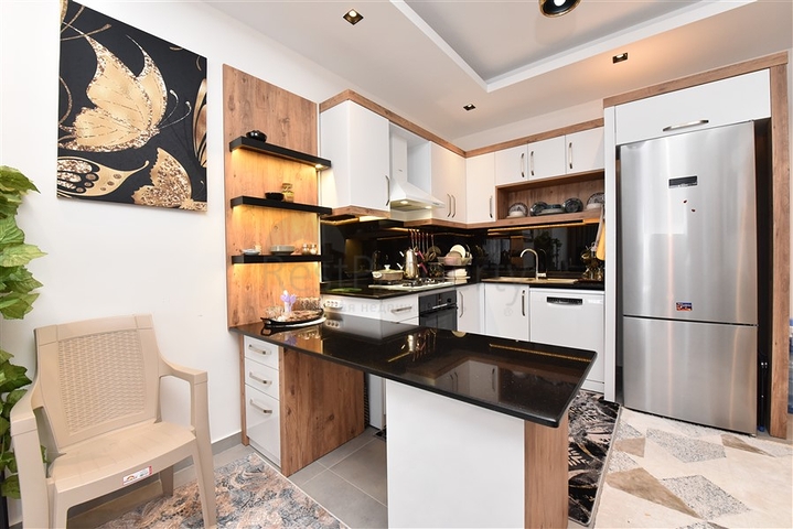 Меблированная двухкомнатная квартира в районе Махмутлар