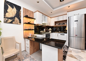 Меблированная двухкомнатная квартира в районе Махмутлар