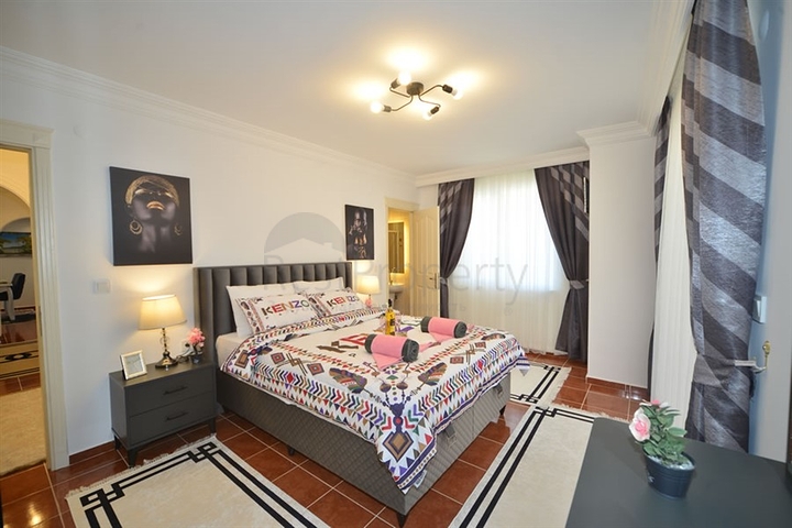 Трехкомнатная квартира в районе Махмутлар