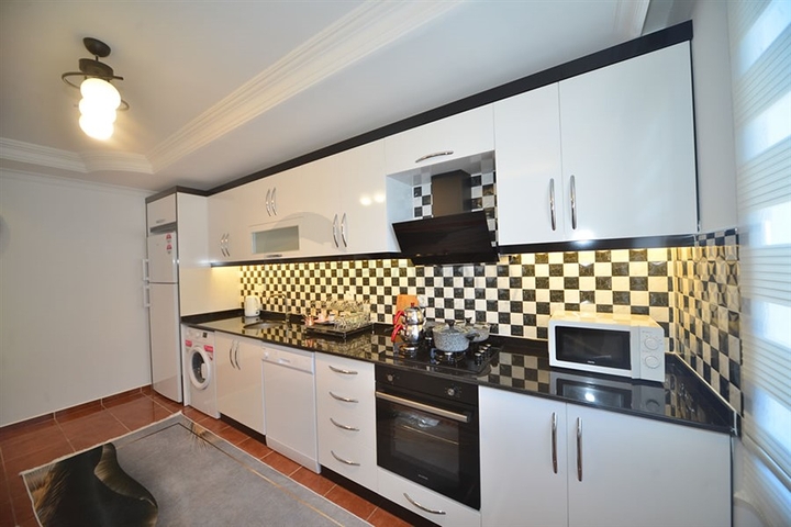 Трехкомнатная квартира в районе Махмутлар