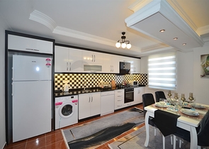 Трехкомнатная квартира в районе Махмутлар